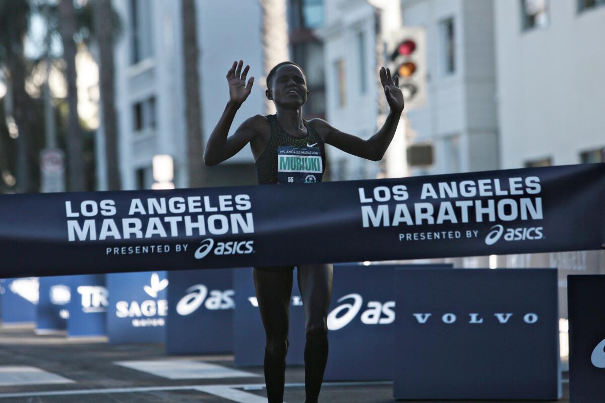 Margaret Muriuki, 34, of Kenya, completes the 2020 Los Angeles Marathon on Sunday in Santa Monica.