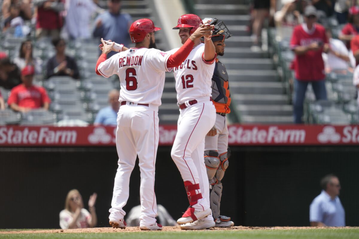 Angels' Anthony Rendon and Hunter Renfroe celebrate after they both scored on a home run hit by Renfroe.