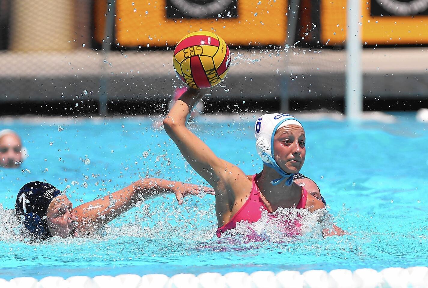 Jaleh Moaddeli of CdM shoots and scores during the USA Water Polo Junior Olympics girls' 18U platinum division game against rival Newport Beach at Capistrano Valley High School on Saturday.