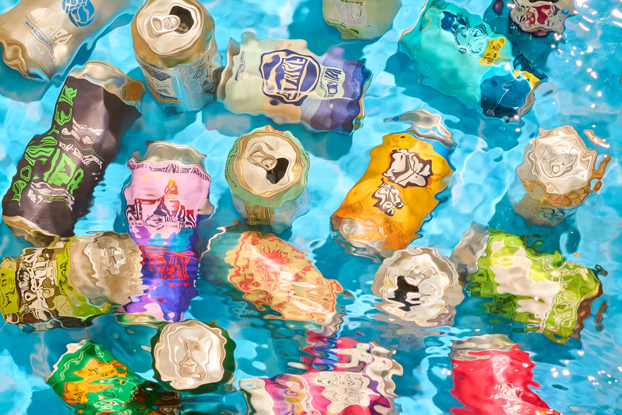 Nonalcoholic beer cans swimming in water