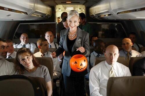 Cindy McCain offers Halloween candy to members of the press aboard the McCain "Straight Talk Express" campaign plane.