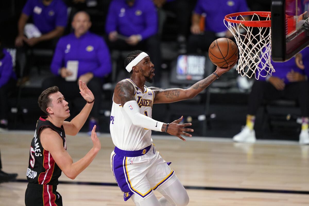 Lakers guard Kentavious Caldwell-Pope beats Heat forward Duncan Robinson for layup during Game 6 of the NBA Finals.