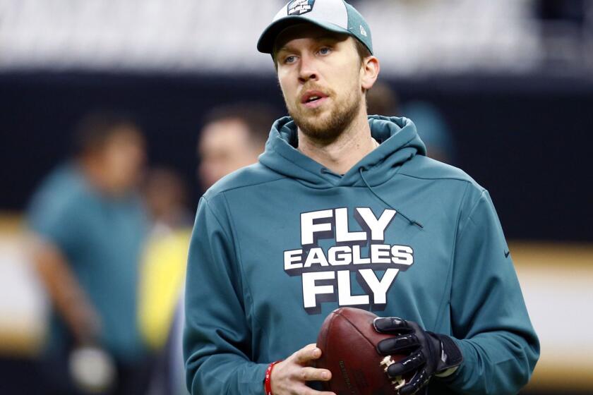FILE - In this Jan. 13, 2019, file photo, Philadelphia Eagles quarterback Nick Foles warms up before an NFL divisional playoff football game against the New Orleans Saints in New Orleans. Eagles general manager Howie Roseman said Wednesday, Feb. 27,2 019, that the team will not use its franchise tag on Foles and instead will let him become a free agent. (AP Photo/Butch Dill, File)