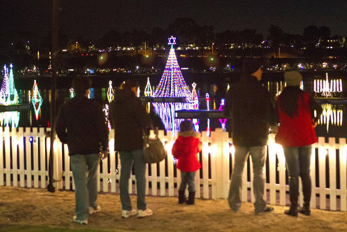 Families gather to view decorations at the Newport Dunes Waterfront Resort & Marina in 2015.