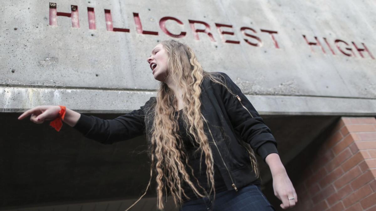 Hillcrest High School junior Kylee Denny addresses classmates as they participate in a walkout to protest gun violence on Wednesday, March 14, 2018, in Idaho Falls, Idaho, one month after the deadly shooting inside a high school in Parkland, Fla.