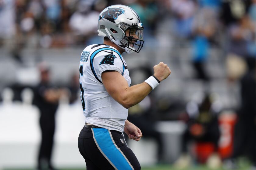 Carolina Panthers quarterback Baker Mayfield (6) celebrates a touchdown throw during the second half of an NFL football game against the New Orleans Saints, Sunday, Sept. 25, 2022, in Charlotte, N.C. (AP Photo/Jacob Kupferman)