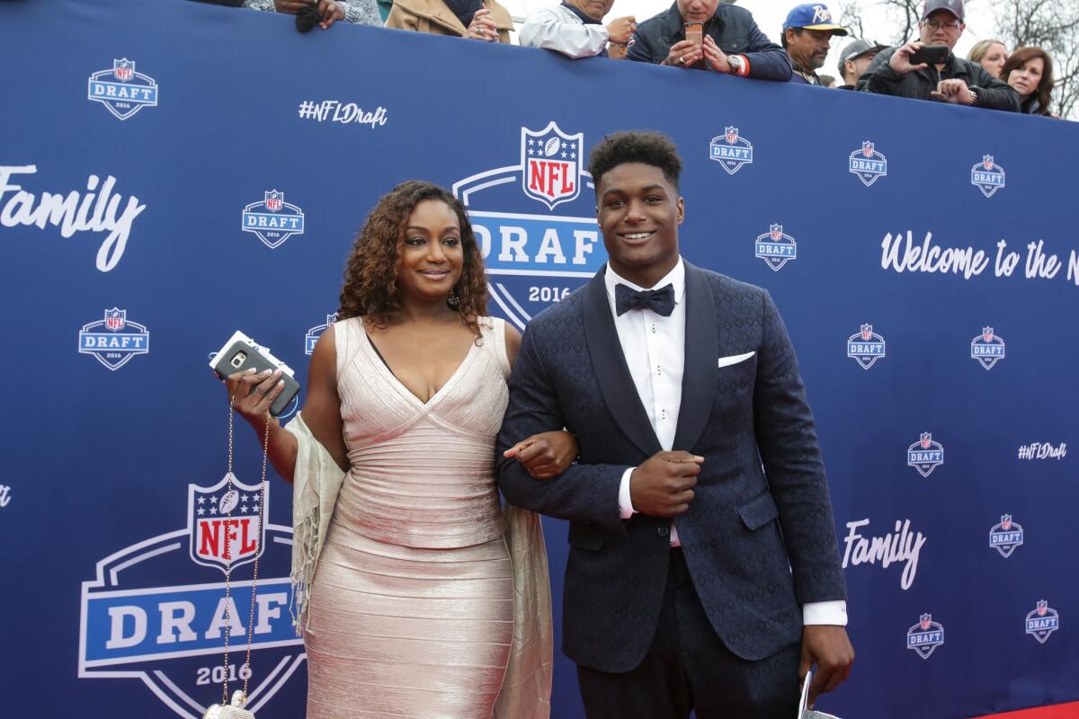 UCLA star Myles Jack arrives for the first round of the NFL draft in Chicago with his mother, La Sonjia Fisher, on Thursday evening.