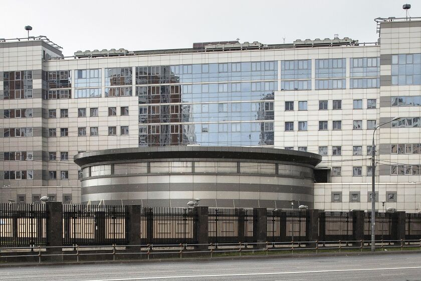 FILE - This Saturday, July 14, 2018 file photo shows the building of the Main Directorate of the General Staff of the Armed Forces of Russia, also know as Russian military intelligence service in Moscow, Russia. After seeing its secrets increasingly exposed by determined journalists and Kremlin critics, the Russian military intelligence agency known as the GRU endured another hit Friday, Oct. 26: A new report details misbehavior, sloppiness and bizarre bureaucratic decisions that allowed a Russian journalist to identify multiple alleged GRU officers. While no one is suspected of grave wrongdoing, journalist Sergei Kanev says he wants to call attention to problems within an organization that he feels has crossed a line beyond traditional spying into unchecked violence and foreign interference. (AP Photo/Pavel Golovkin, File)