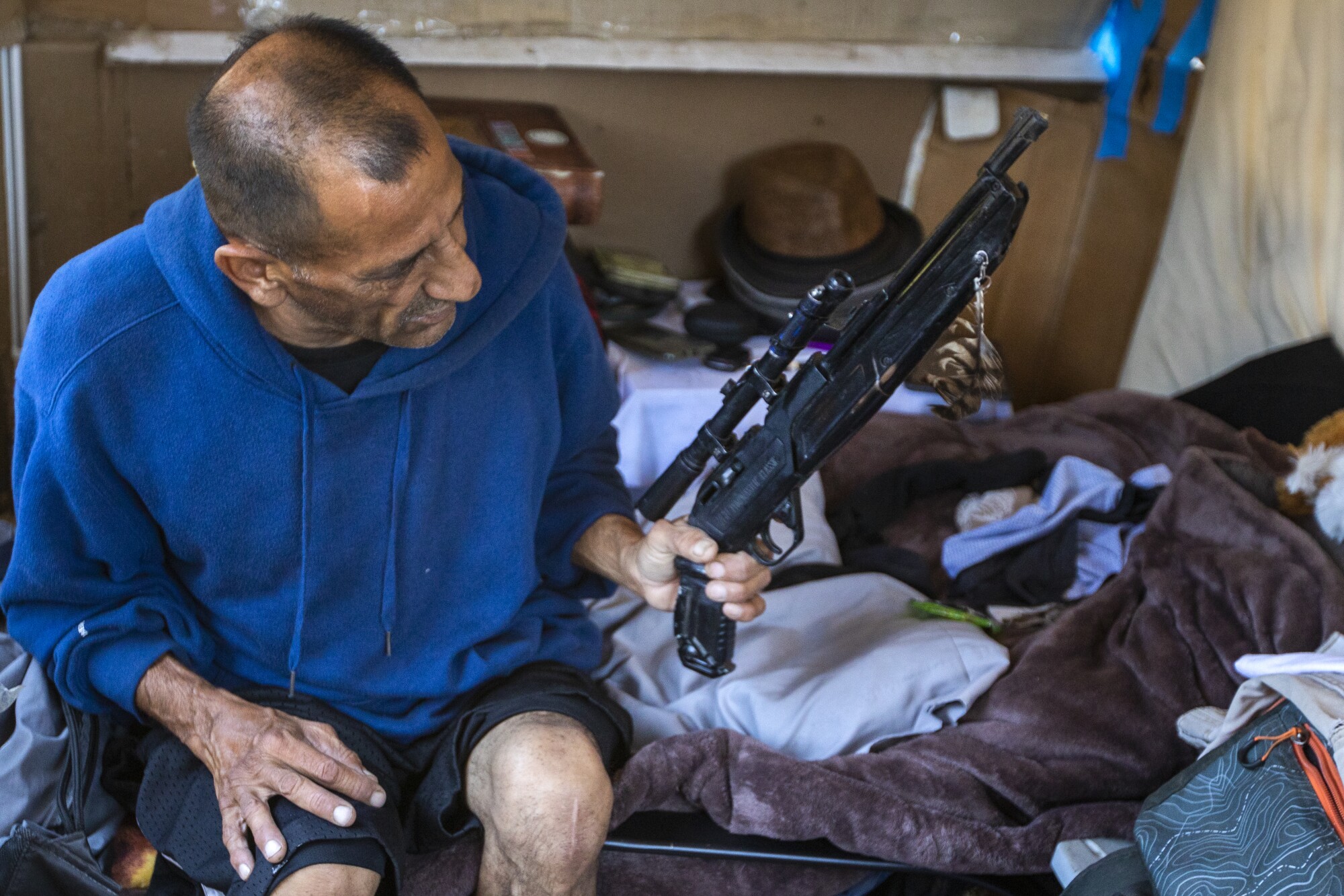 A man holding an air rifle