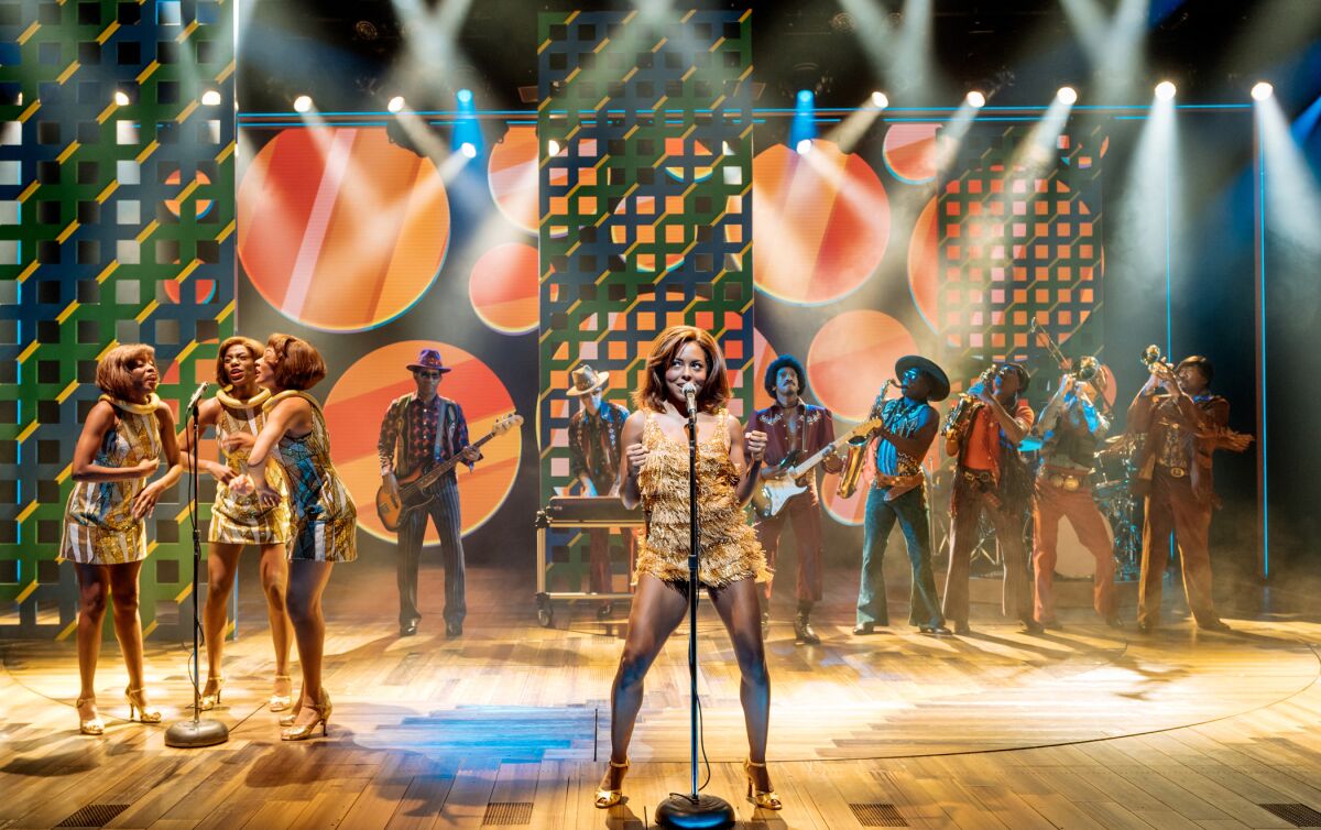 Adrienne Warren, center, and the company of "Tina: The Tina Turner Musical."