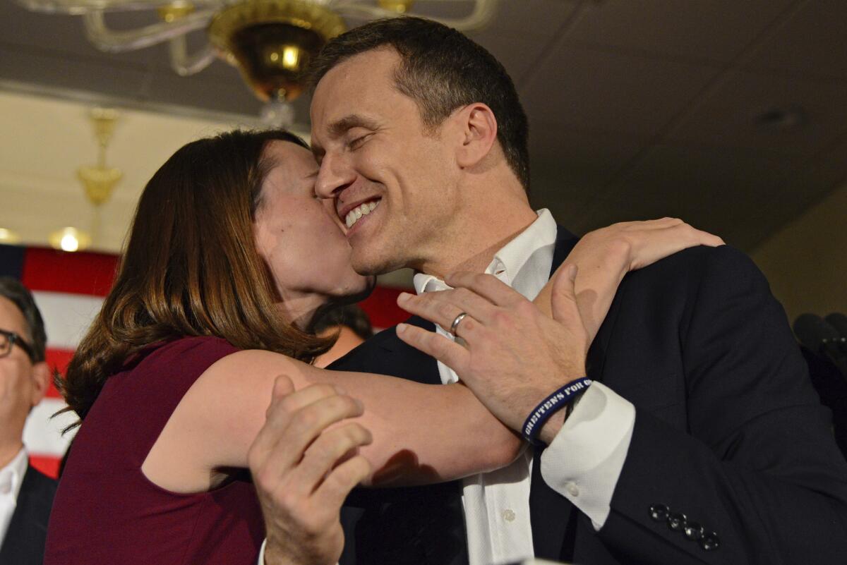 Missouri Republican Governor-elect Eric Greitens hugs his wife Sheena as he delivers a victory speech Tuesday, Nov. 8, 2016, in Chesterfield, Mo. (AP Photo/Jeff Curry)
