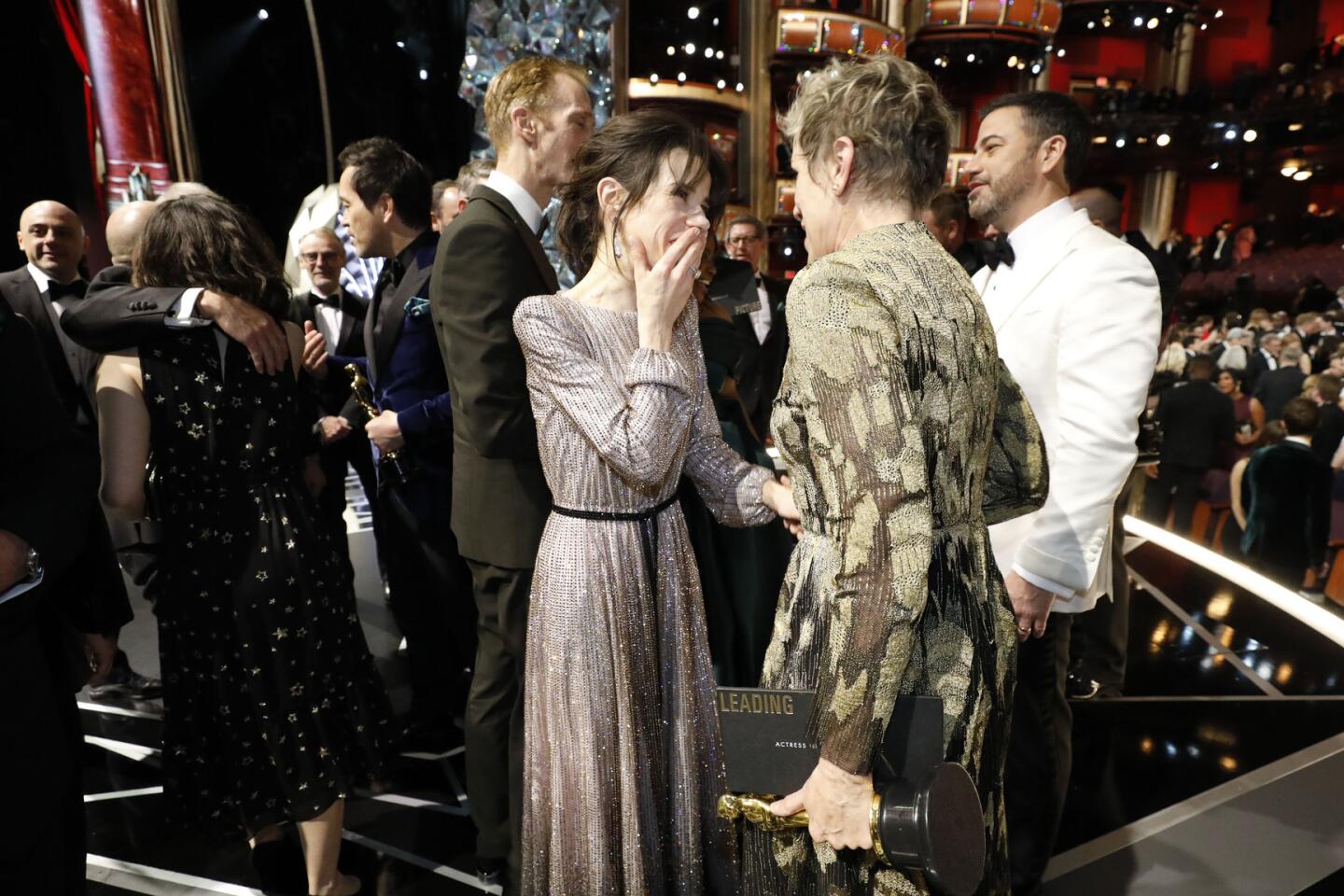 Oscar nominee Sally Hawkins and winner Frances McDormand talk backstage at the Academy Awards.