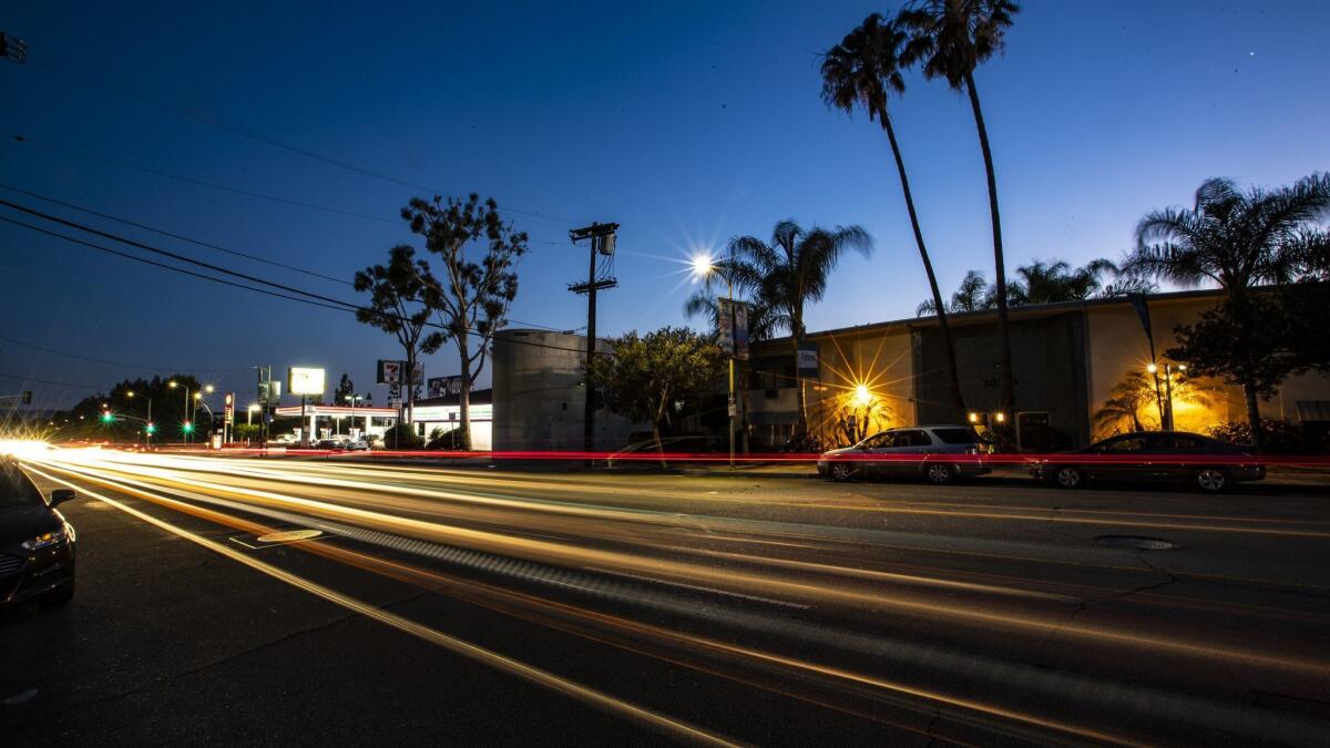 A long exposure captures the trail of lights from vehicles traveling at dusk down a two-mile stretch of Zelzah Avenue in Northridge.