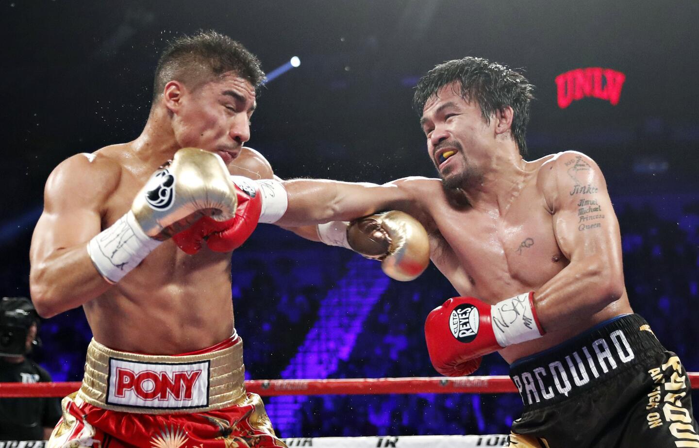 Manny Pacquiao connects to the face of Jessie Vargas during their WBO welterweight title bout in Las Vegas on Saturday night.