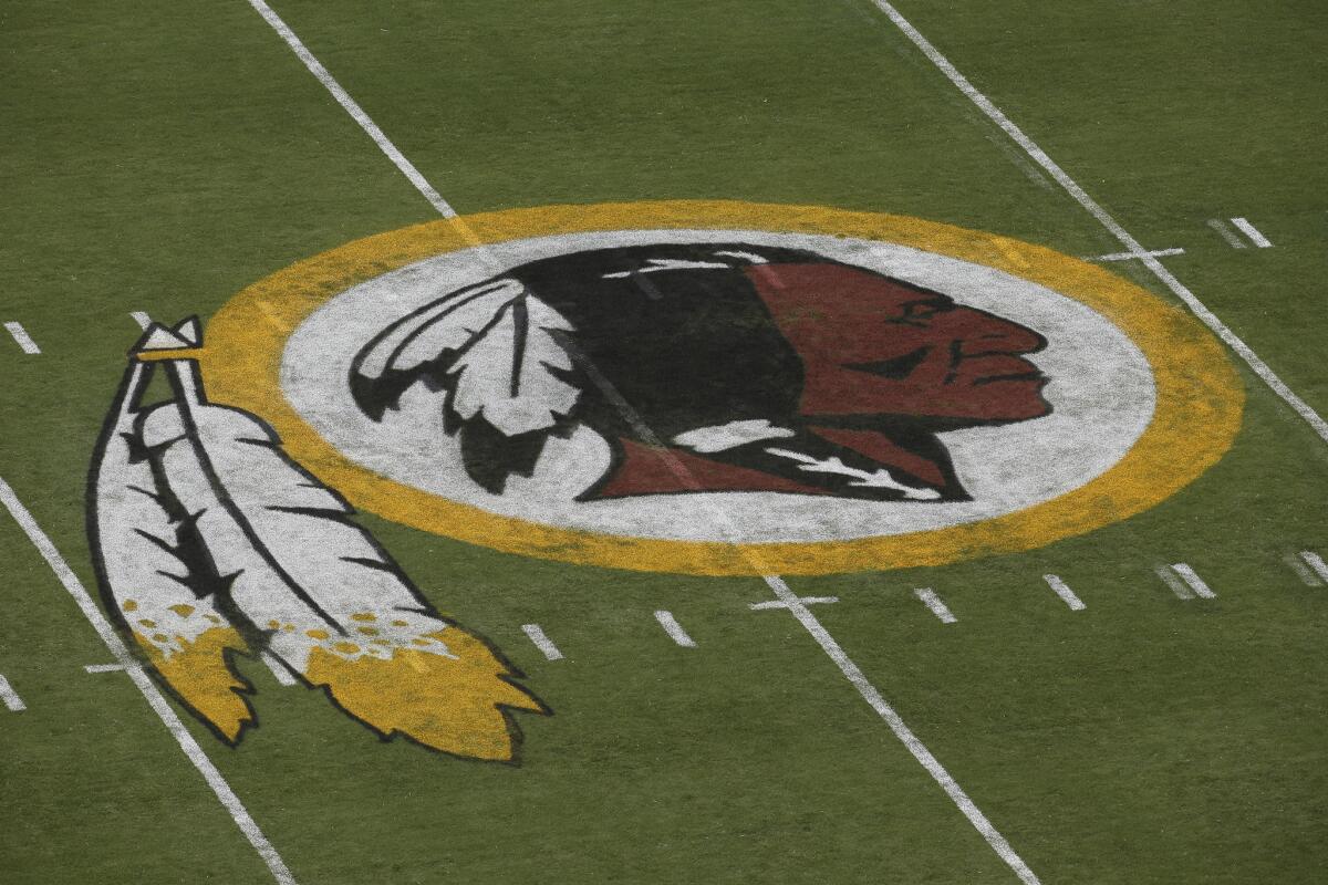 A federal judge has ordered the Patent and Trademark Office to cancel registration of the Washington Redskins' trademark, ruling that the team name may be disparaging to Native Americans.