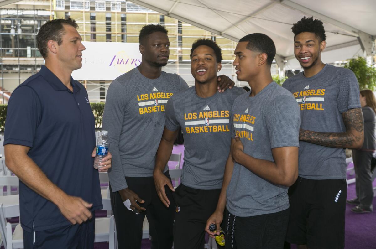 Lakers Coach Luke Walton, from left, and players Julius Randle, Anthony Brown, Jordan Clarkson and Brandon Ingram at a team ceremony in August. The Lakers will hold their training camp at UC Santa Barbara.