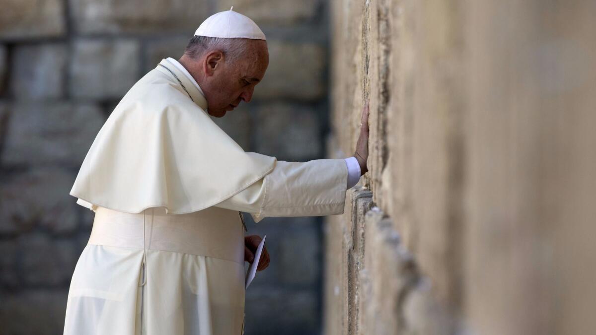 Pope Francis prays at the Western Wall in Jerusalem in 2014.