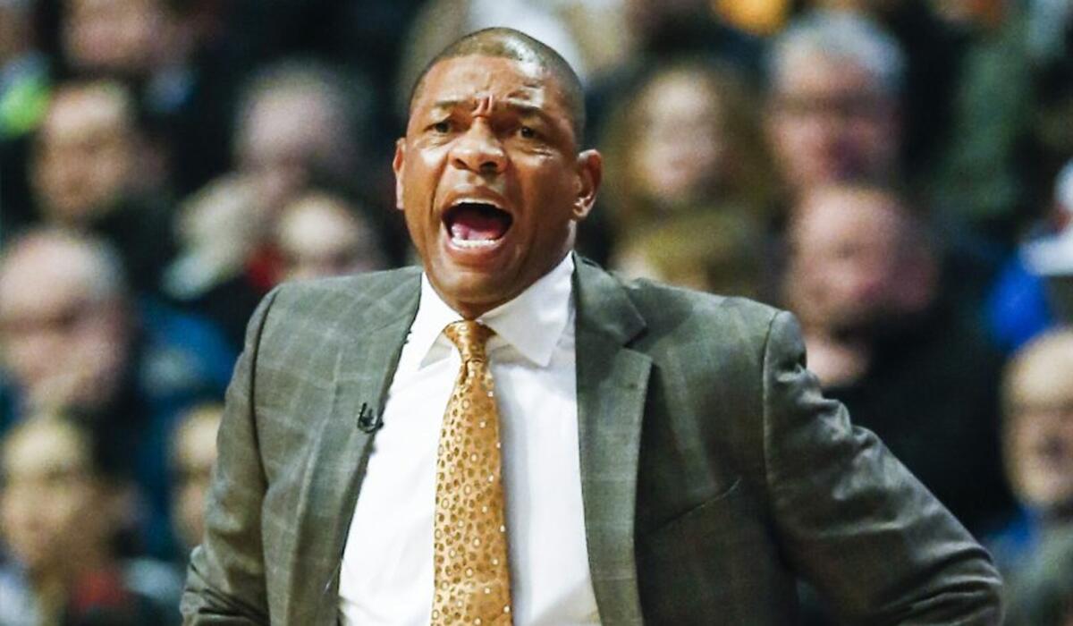 Clippers Coach Doc Rivers shouts to his team in the first half.