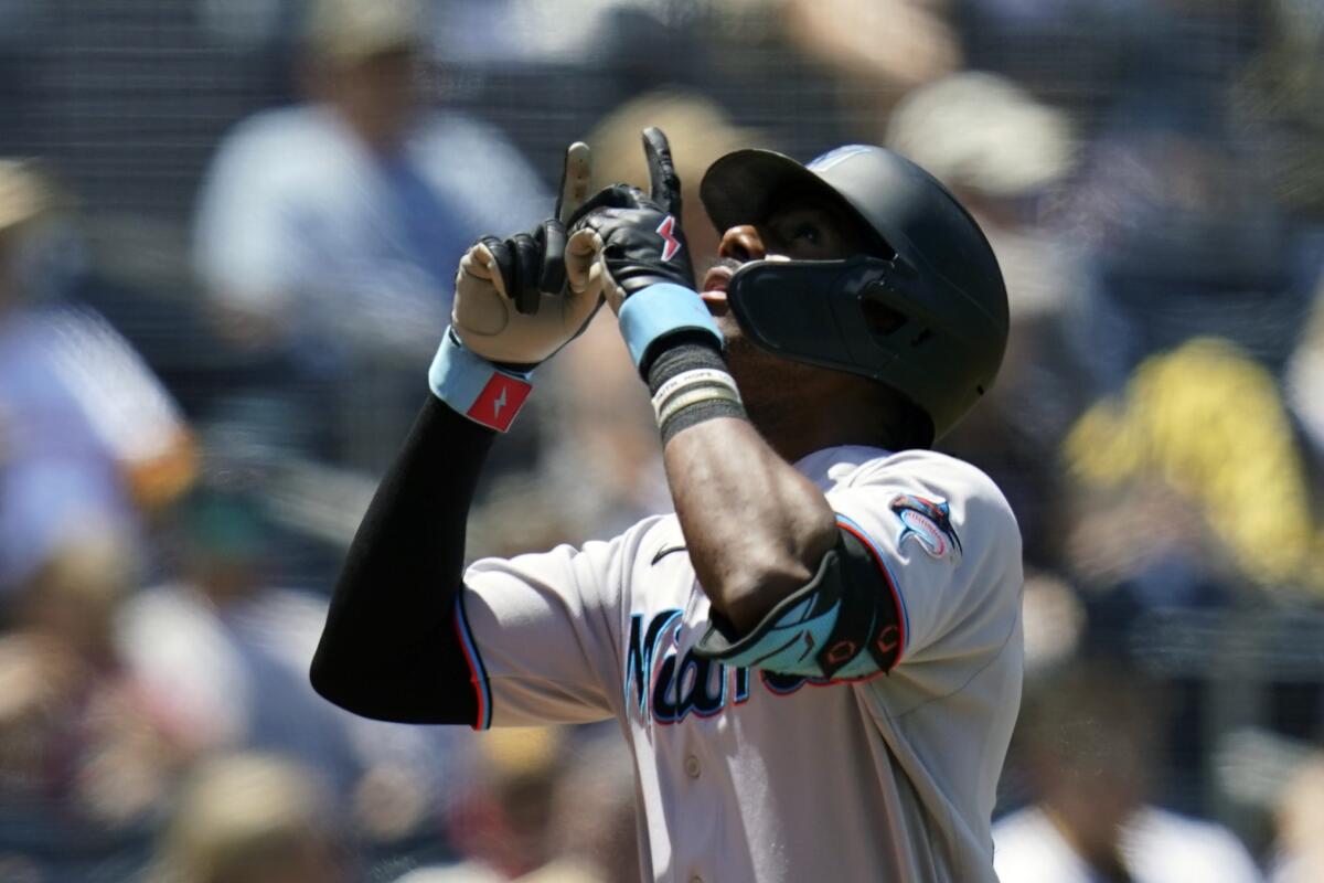 Miami Marlins' Lewis Brinson reacts after hitting a two-run home run during the first inning of a baseball game against the San Diego Padres, Wednesday, Aug. 11, 2021, in San Diego. (AP Photo/Gregory Bull)