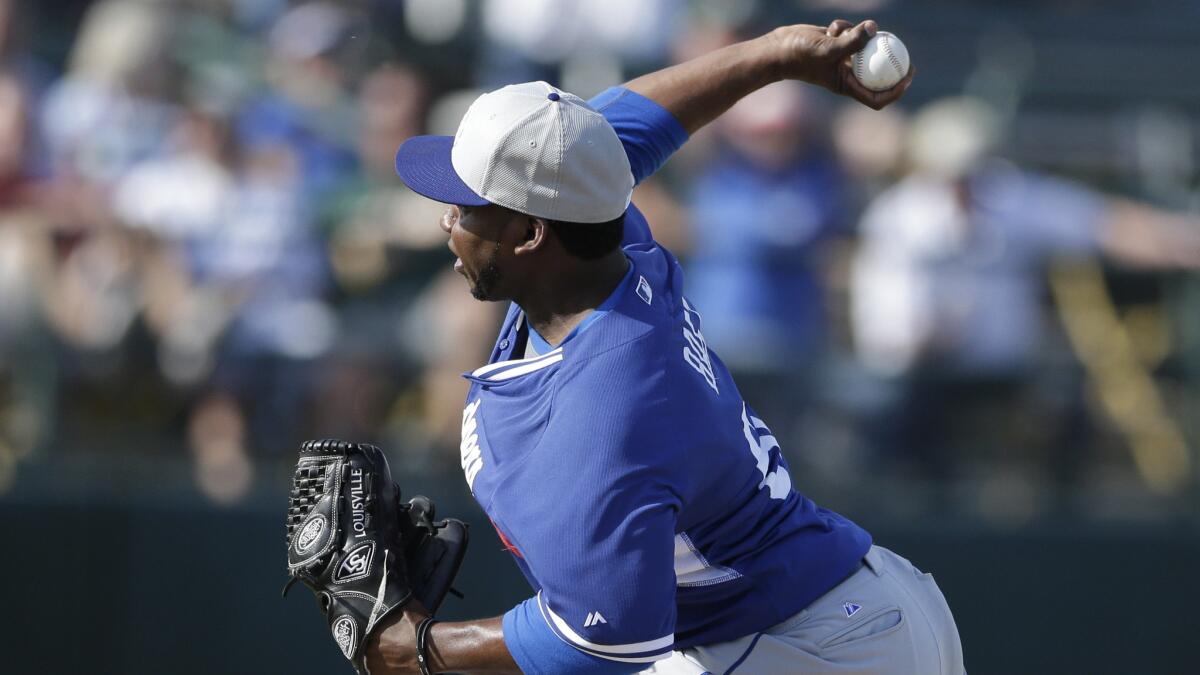 Dodgers reliever Pedro Baez delivers a pitch during a spring training game against the Oakland Athletics in March.