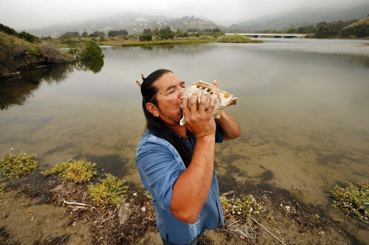 Mati Waiya performs a ceremony in 2010 at the Malibu Lagoon. Is blowing into a conch an actual Chumash practice? Some say no.