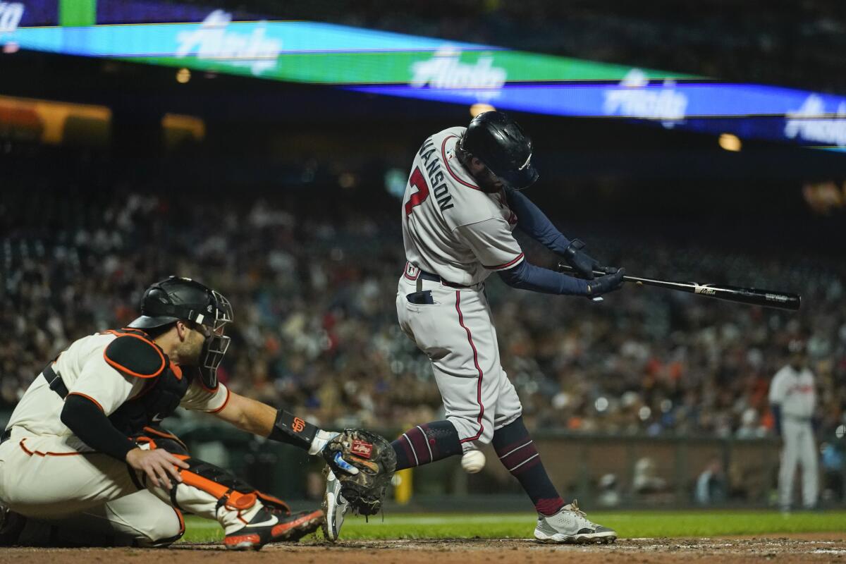 Atlanta Braves' Dansby Swanson (7) strikes out against the San Francisco Giants during the sixth inning of a baseball game in San Francisco, Monday, Sept. 12, 2022. (AP Photo/Godofredo A. Vásquez)