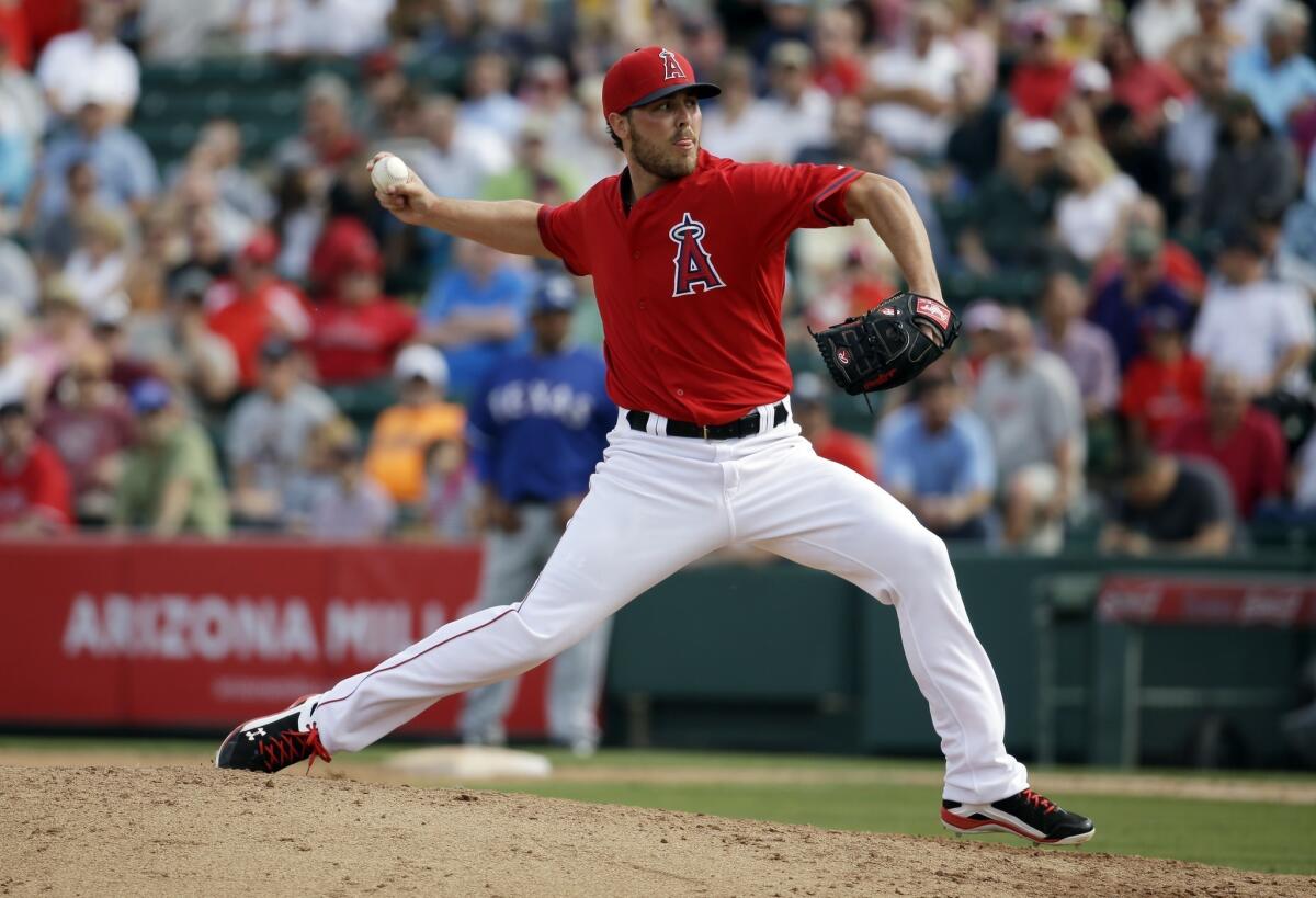 Angels reliever Michael Kohn delivers a pitch during an exhibition game against the Texas Rangers in March.