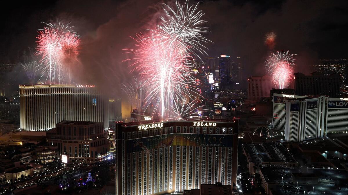 Fireworks explode over the Las Vegas Strip during the New Year's Eve celebration.
