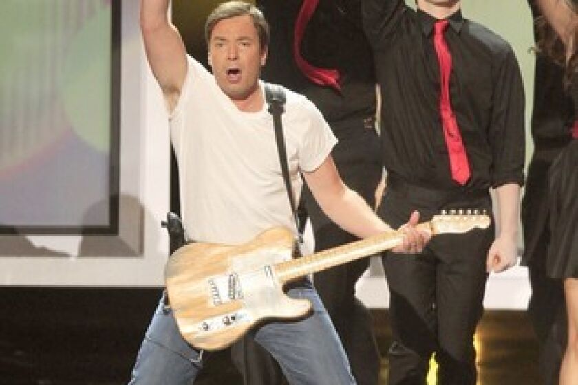 By Patrick Kevin Day and Lisa Fung We must admit having mixed feelings about host Jimmy Fallon's "Glee"-style opening to the tune of Bruce Springsteen's "Born to Run." On the one hand, it's nothing new. Fallon has already done a "Glee" parody with the cast of "Parks and Recreation" on his "Late Night" show. But this one was done with such energy that it's hard to be a hater. Besides, who can be angry when someone's singing the Boss?