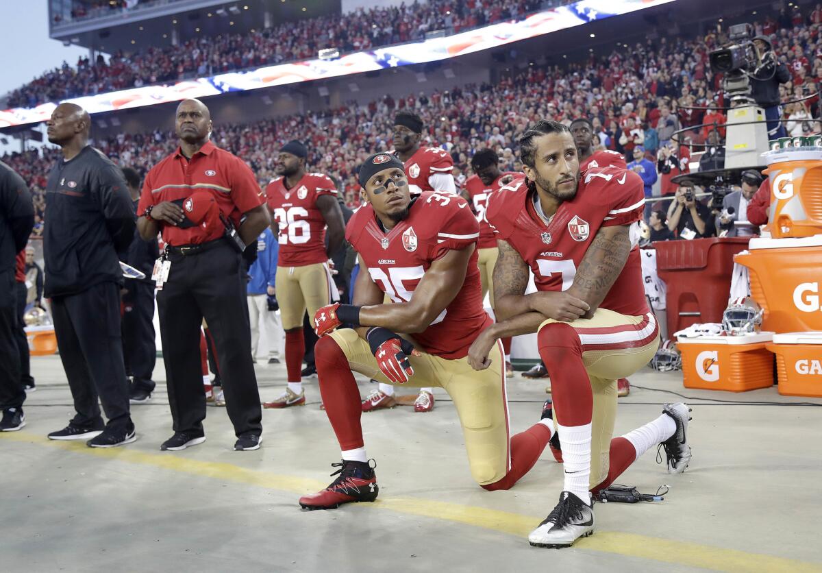 FILE - In this Sept. 12, 2016, file photo, San Francisco 49ers safety Eric Reid (35) and quarterback Colin Kaepernick (7) kneel during the national anthem before an NFL football game against the Los Angeles Rams in Santa Clara, Calif. Despite their vastly divergent methods, Colin Kaepernick and LeBron James helped set a stake in the ground, declaring to athletes across all sports that their platforms could be used for more than fun and games in the 21st century. (AP Photo/Marcio Jose Sanchez, File)