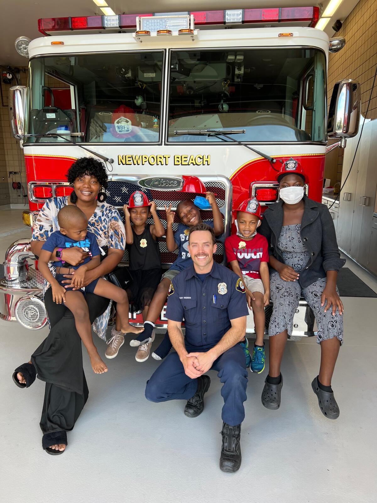 Katrina Taylor-Hill's children and paramedic Cory Freeman.