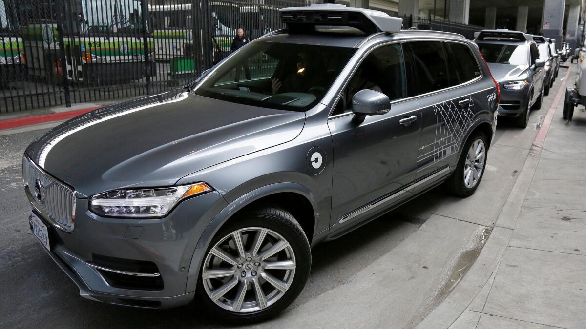 An Uber self-driving car heads out for a test drive in San Francisco in December.