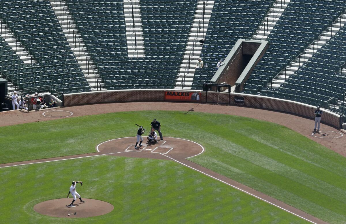 Orioles starter Ubaldo Jimenez delivers a pitch to the White Sox's Adam Eaton during the first inning of a baseball game played without spectators on April 29, 2015, because of civil unrest in Baltimore.