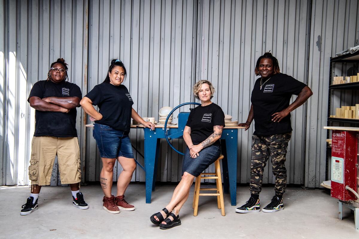 Four women in a ceramics studio