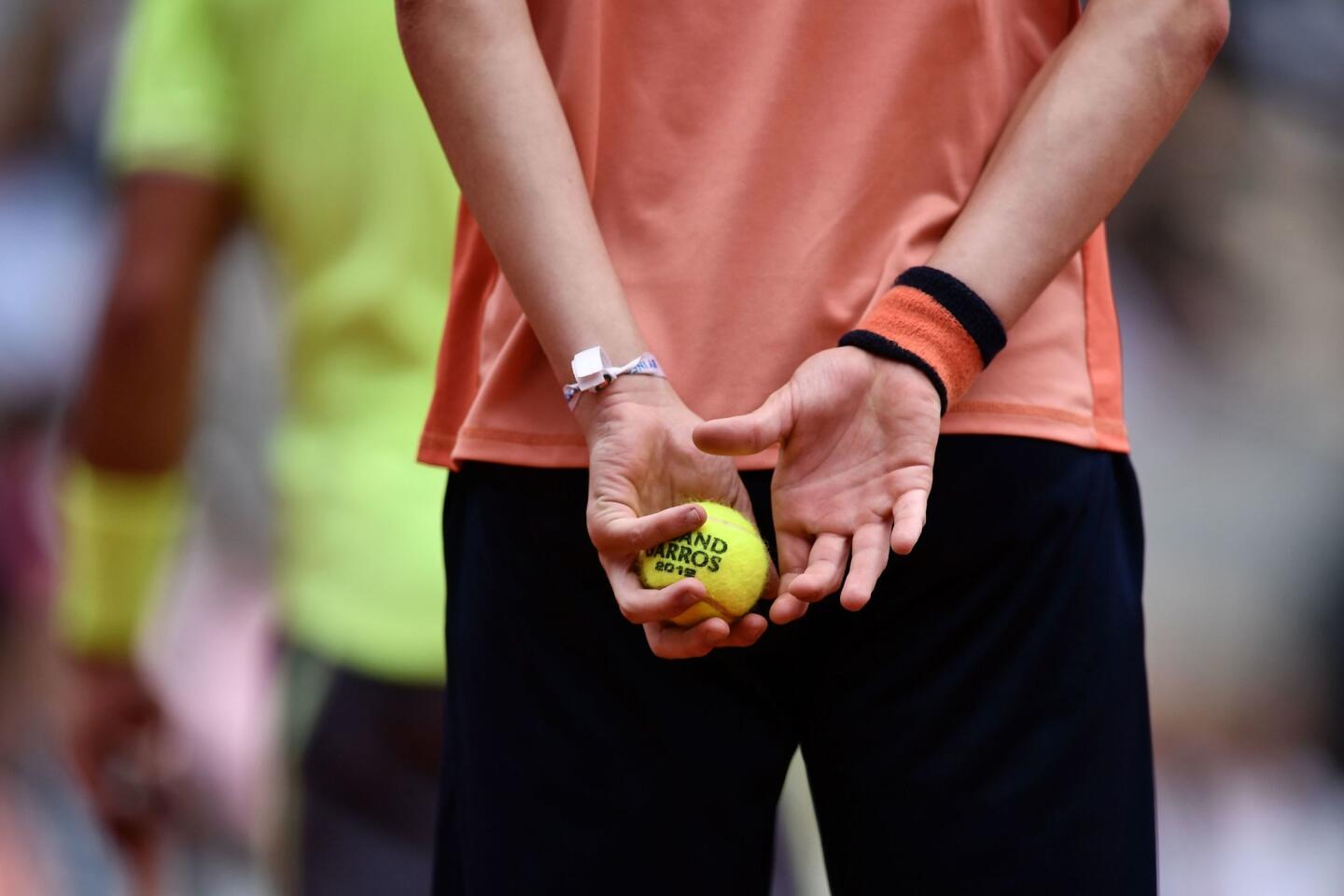 A ballboy holds the 2019 French Open tennis tournament official ball during the men's singles final match between Spain's Rafael Nadal and Austria's Dominic Thiem on day fifteen of The Roland Garros 2019 French Open tennis tournament in Paris on June 9, 2019. (Photo by Philippe LOPEZ / AFP)PHILIPPE LOPEZ/AFP/Getty Images ** OUTS - ELSENT, FPG, CM - OUTS * NM, PH, VA if sourced by CT, LA or MoD **