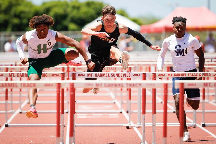 San Diego, CA - May 18: Helix's Shon Martin, El Capitan's Jonathan Tseko-Biffle, and San Marcos' Caleb Reese compete in the 110 meter hurdles during the CIF San Diego Section Track and Field Championships at Mt. Carmel High School on Saturday, May 18, 2024 in San Diego, CA. (Meg McLaughlin / The San Diego Union-Tribune)