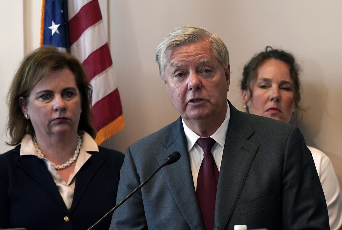 Sen. Lindsey Graham, center