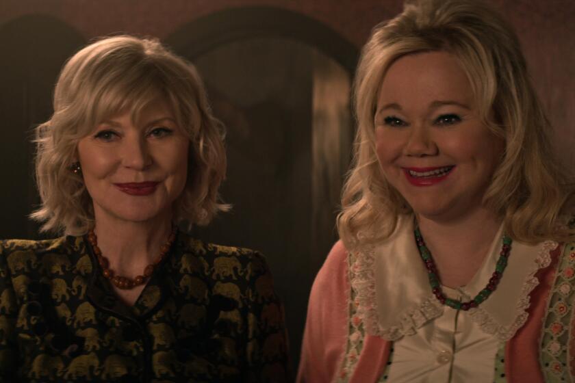 Beth Broderick's Zelda and Caroline Rhea's Hilda smiling in "Chilling Adventures of Sabrina"
