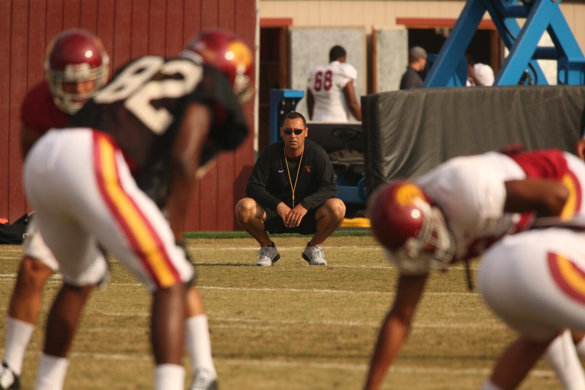 USC Coach Steve Sarkisian watches practice on Aug. 25.