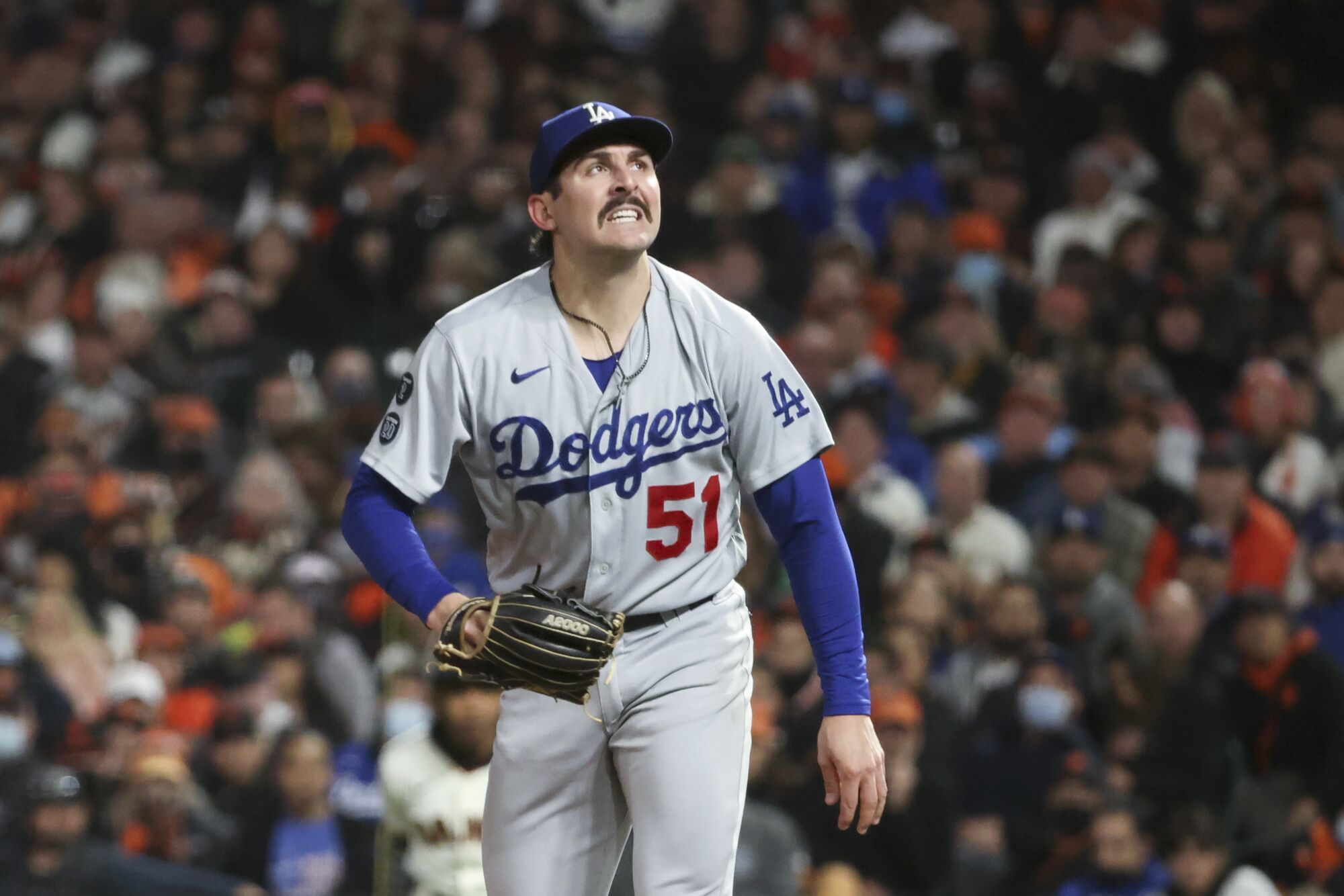 Dodgers relief pitcher Alex Vesia reacts allowing a solo home run by Giants' Brandon Crawford