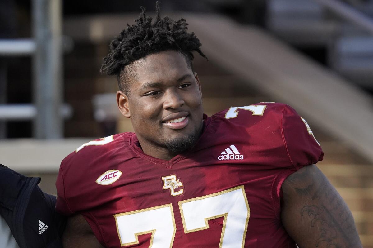 Boston College offensive lineman Zion Johnson  poses for a photo.