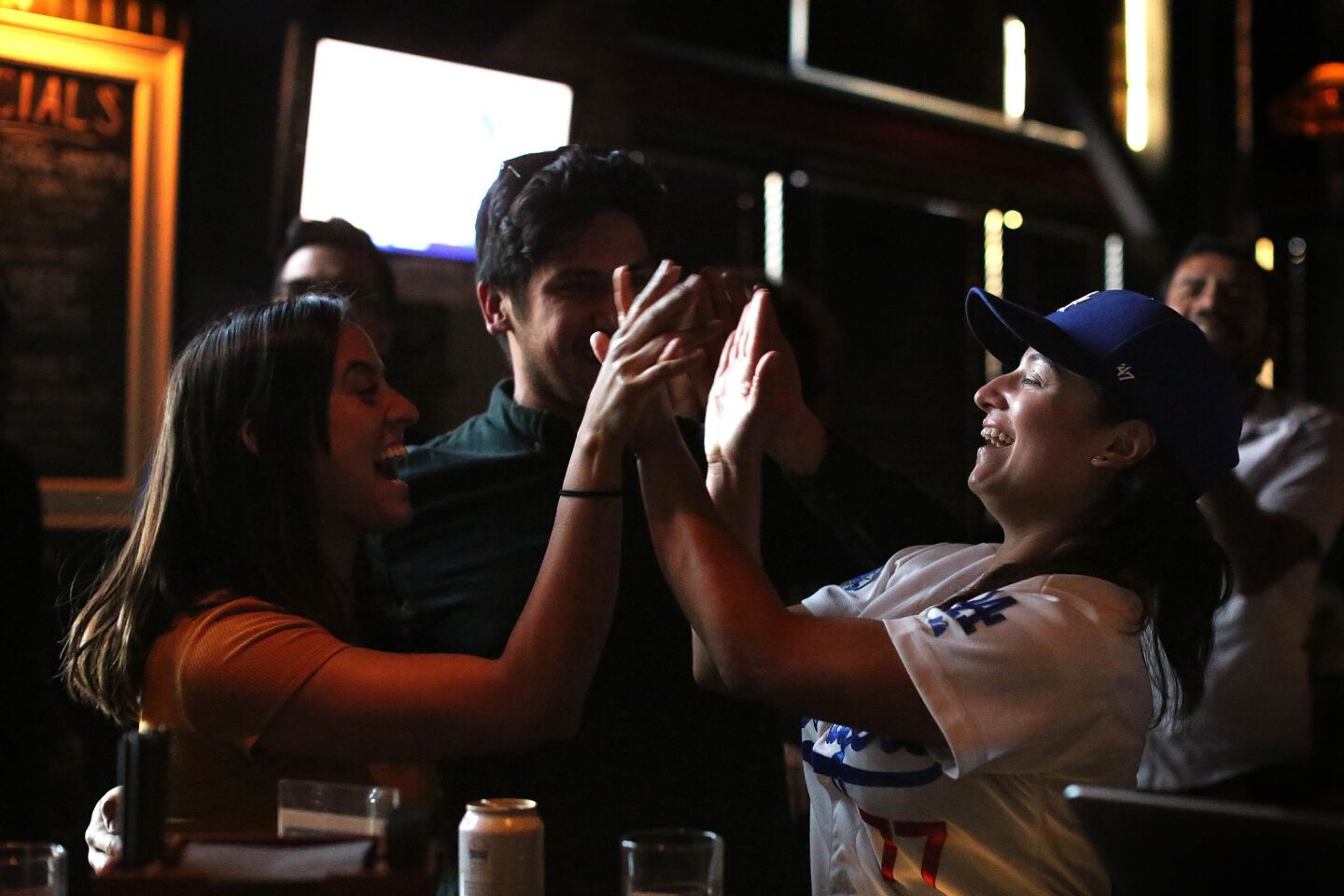 Natalie Lemus and her boyfriend Jaime Ramirez celebrate with Renee Avila Habermehl.