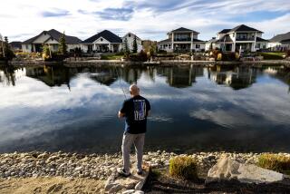 EAGLE, ID - DECEMBER 5, 2023: Retired 30-year veteran of the Los Angeles Sheriffs Department fishes behind his new home on a man-made pond at the master planned community called Legacy on December 5, 2023 in Eagle, Idaho. Across the pond, 90% of the home owners are retired cops from California. Nearly 90,000 members of CalPERS, California's main public employee retirement system, receive their checks outside the state, according to a Times analysis of 2022 data, the most recent year available. But no zip code outside of California received more CalPERS money than 83,616 in tiny, distant Eagle.(Gina Ferazzi / Los Angeles Times)