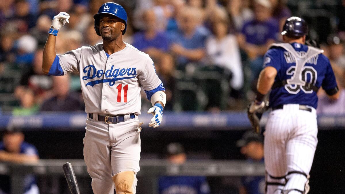 Dodgers shortstop Jimmy Rollins reacts after striking out to end the fifth inning on Friday night in Denver.