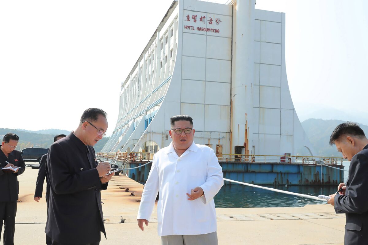 FILE - In this undated photo provided on Oct. 23, 2019, by the North Korean government, North Korean leader Kim Jong Un, center, visits the Diamond Mountain resort in Kumgang, North Korea. South Korean officials confirmed Friday, April 8, 2022, that North Korea is dismantling a South Korean-owned hotel at its Diamond Mountain resort and called for the North to stop its “unilateral” destruction of one of the few remaining symbols of inter-Korean engagement. Independent journalists were not given access to cover the event depicted in this image distributed by the North Korean government. The content of this image is as provided and cannot be independently verified.(Korean Central News Agency/Korea News Service via AP, File)