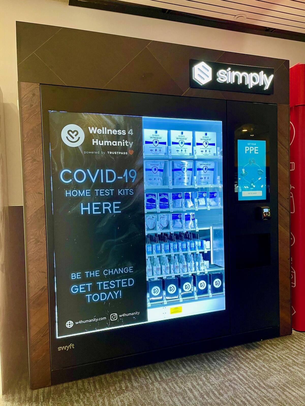 A vending machine at Oakland International Airport sells masks, sanitizer and COVID-19 test kits. 