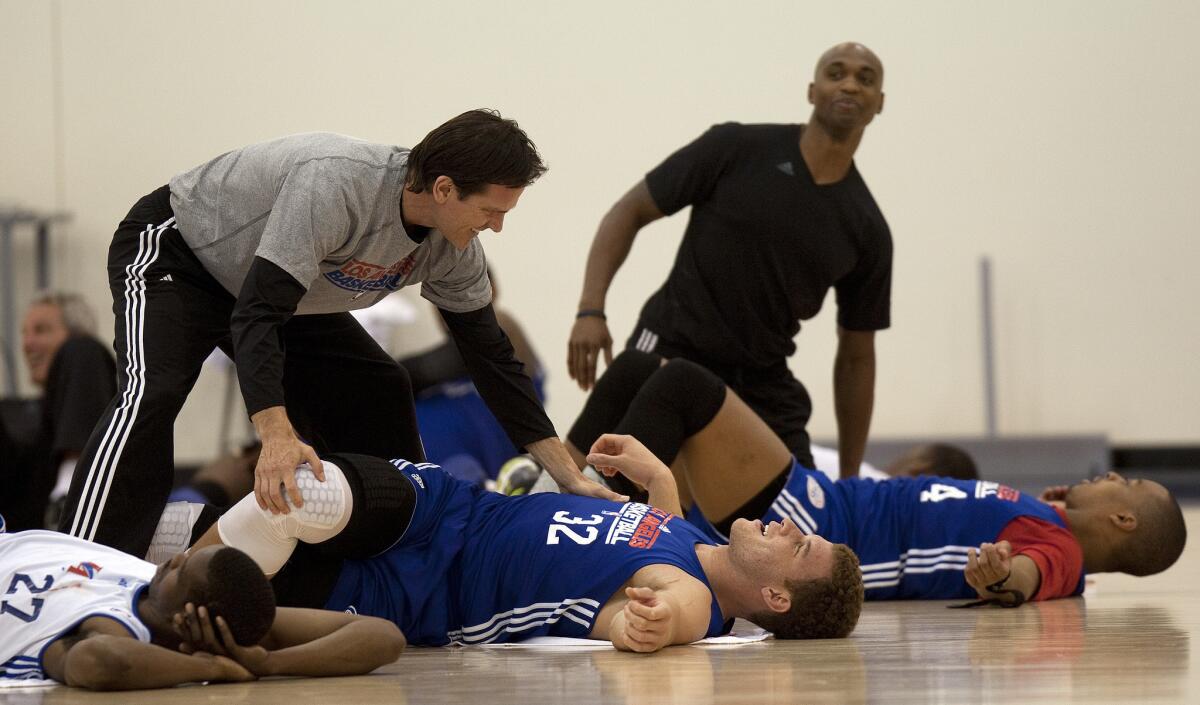 The Clippers have been stretching at least since 2011 as seen in this photo where Blake Griffin gets some help with stretching at the end of practice.