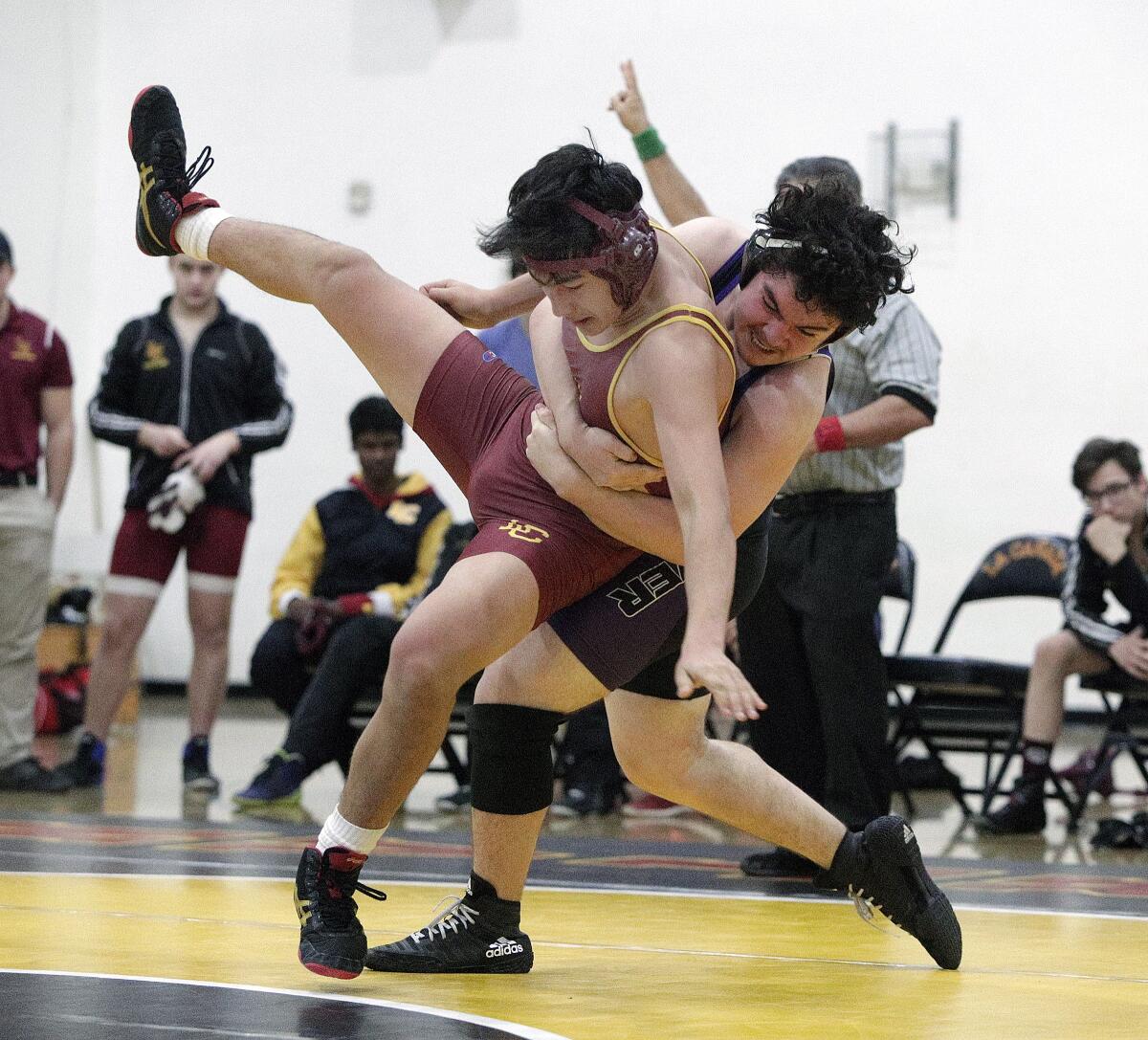 Hoover's Alexandre Hartouniyans takes down La Canada's Ryan Lee in the 182 pound bout in a Rio Hondo League wrestling match at La Canada High School on Monday, January 13, 2020. La Canada won several matches unchallenged when Hoover did not post a wrestler for a weight class. La Canada won the meet.