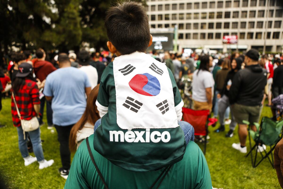 Ayden Martinez-Shin, 4, wears a Mexico shirt decorated with a South Korean flag to show support for both teams at the World Cup watch party Saturday morning at Wilshire Park Place in Koreatown.