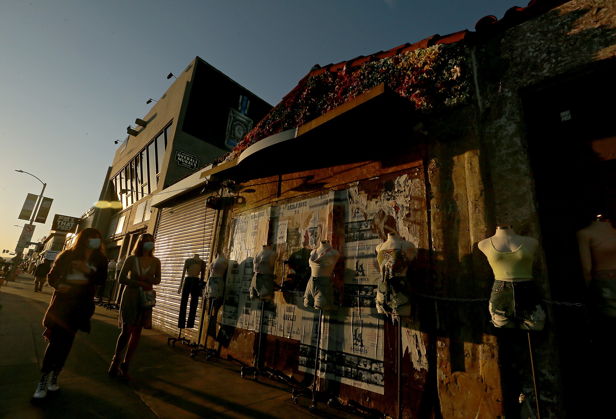 Shoppers walk along Melrose Avenue on March 1.